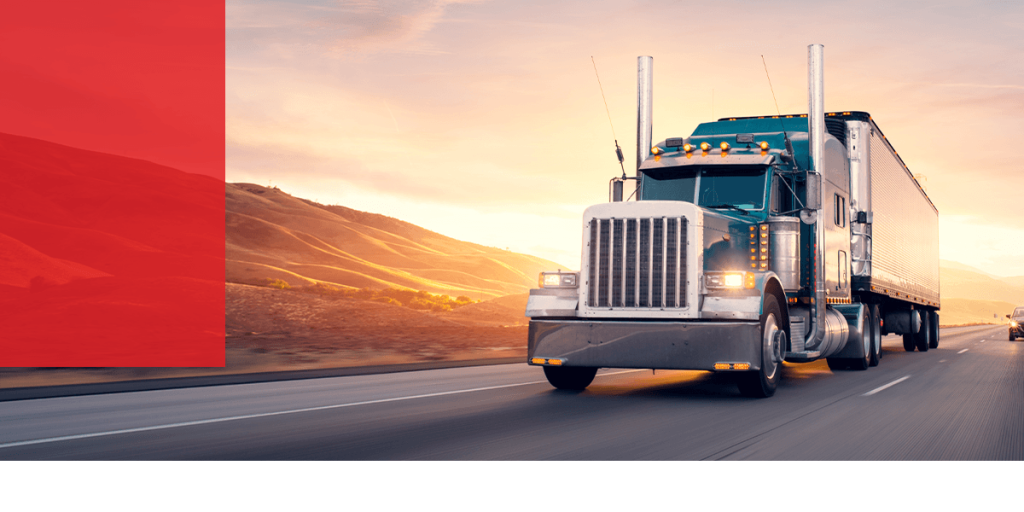 truck driving with a sunset behind them