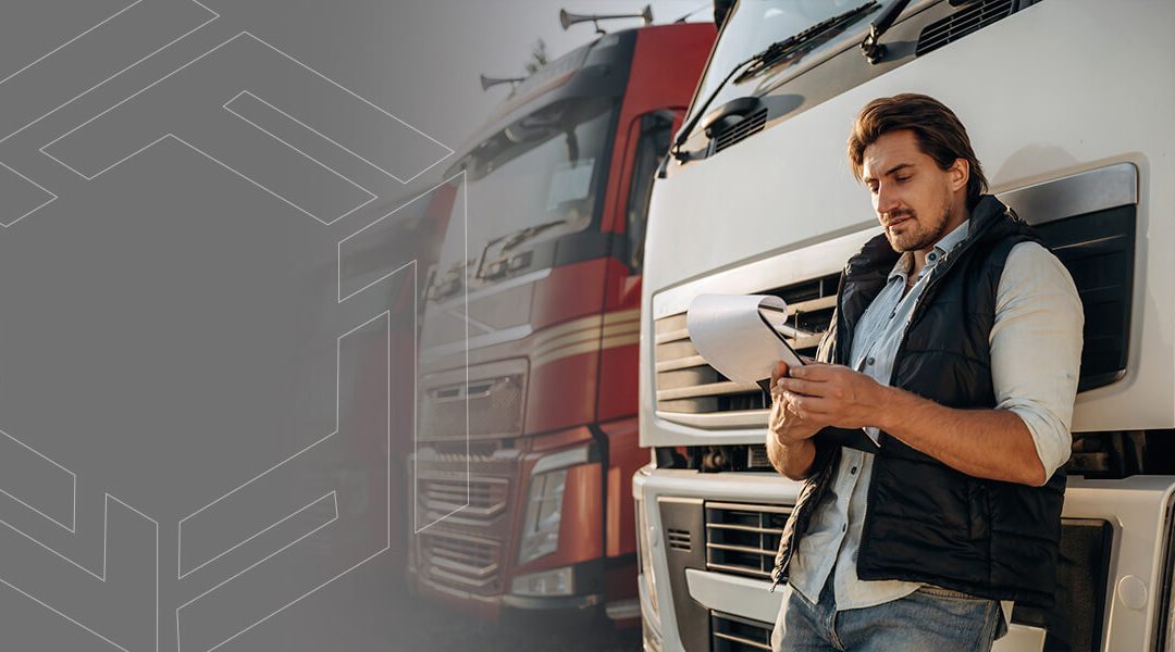 A truck driver reading documents about a UCC Filing.