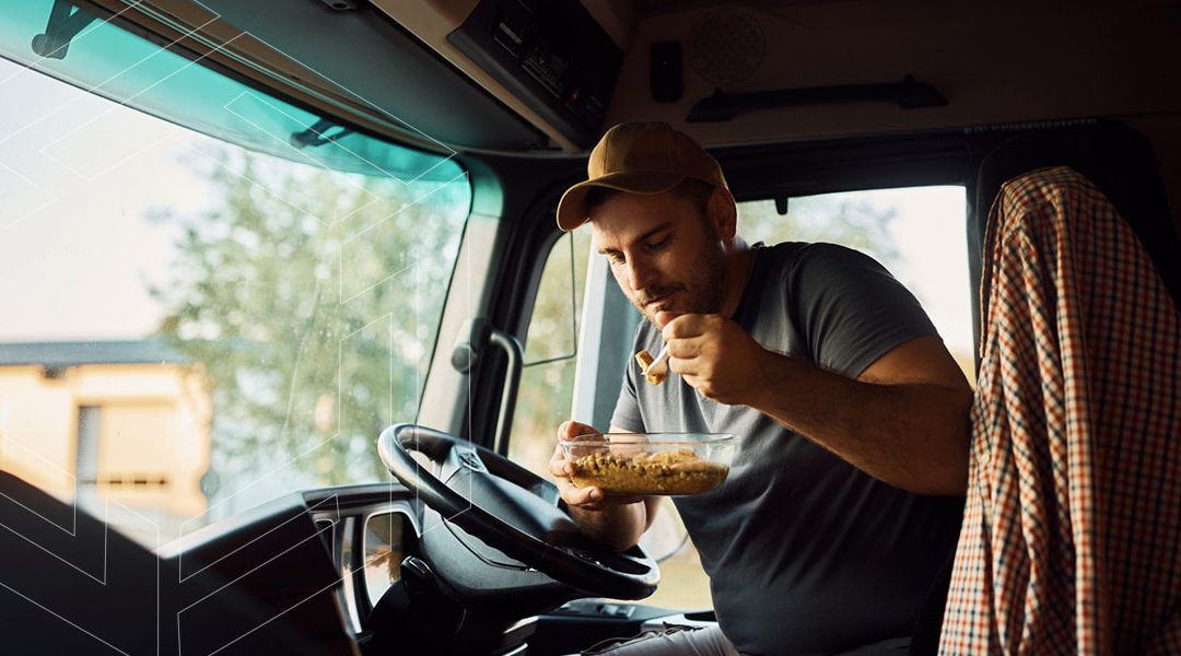 Truck driver eating a healthy meal on the road.
